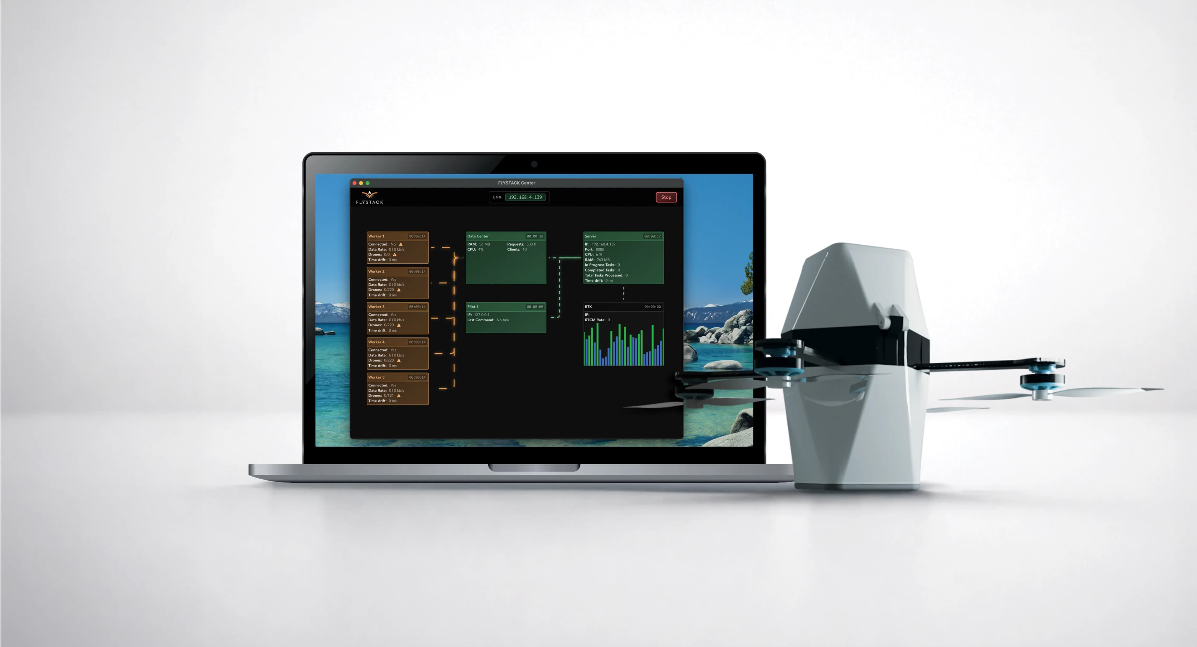 FLYSTACK control software running on a laptop beside a drone