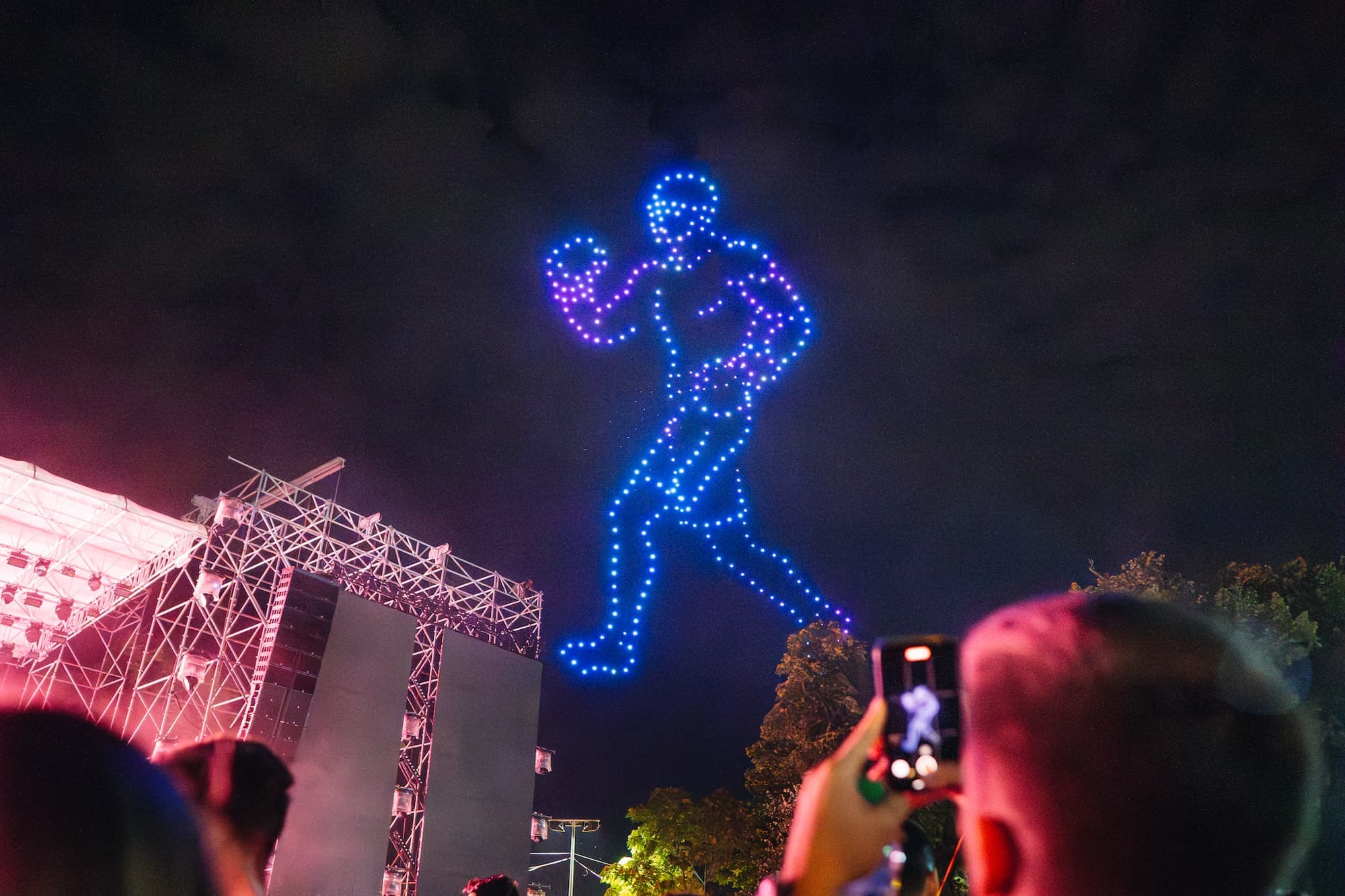 GP4 drone-and-pyrotechnic show figure lighting up the night sky