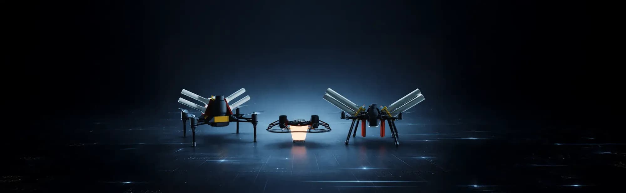 The FLYSTACK fleet — three proprietary drone platforms staged in a dark studio