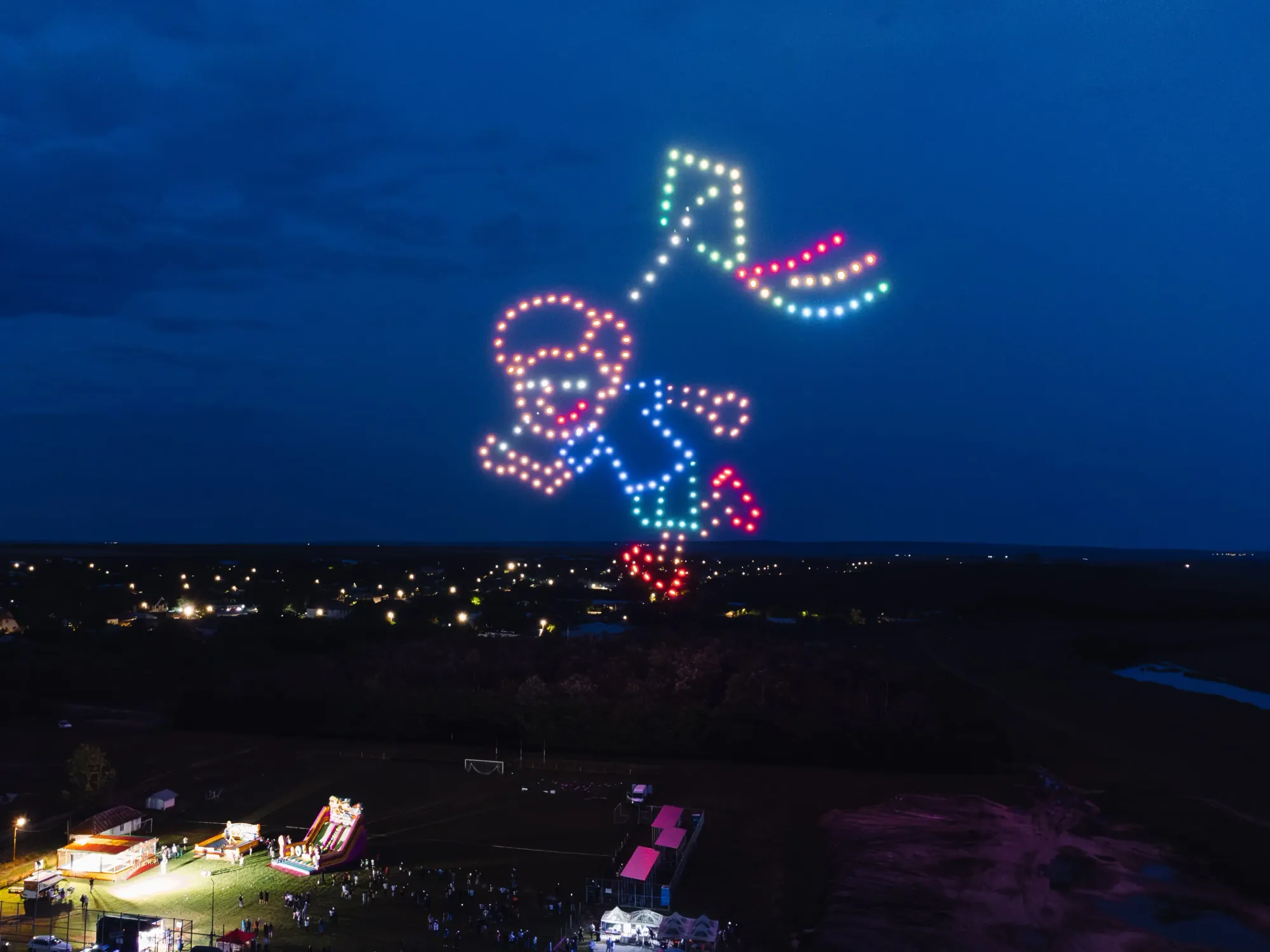 Drone-and-pyrotechnic spectacle over a live audience