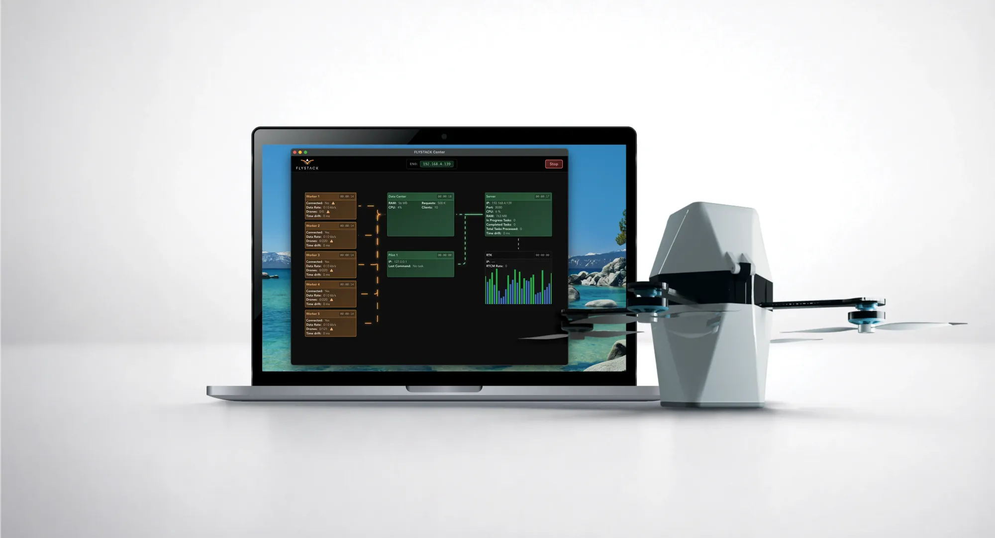 FLYSTACK control software running on a laptop beside a drone