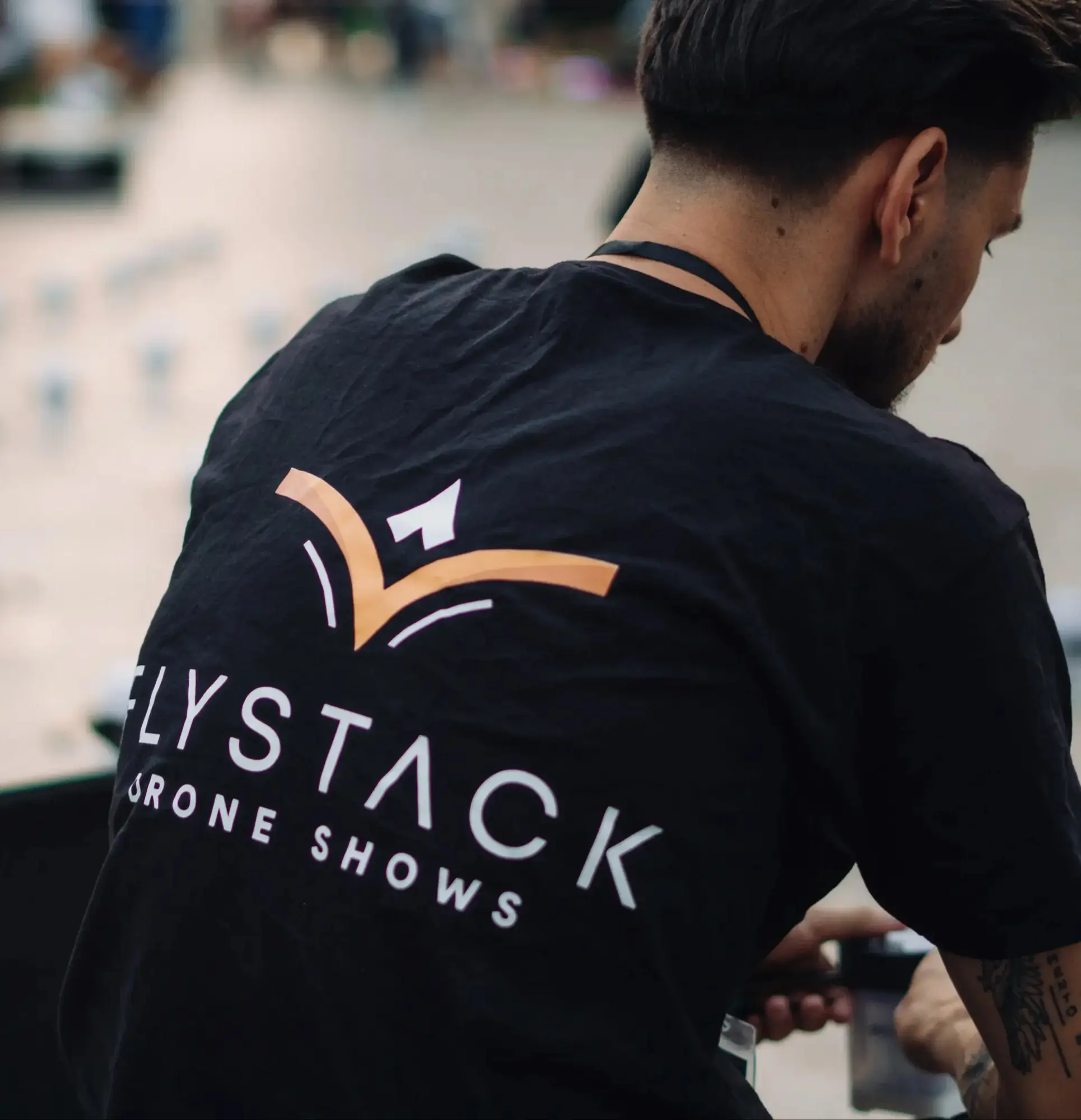 A FLYSTACK technician preparing show equipment before a deployment