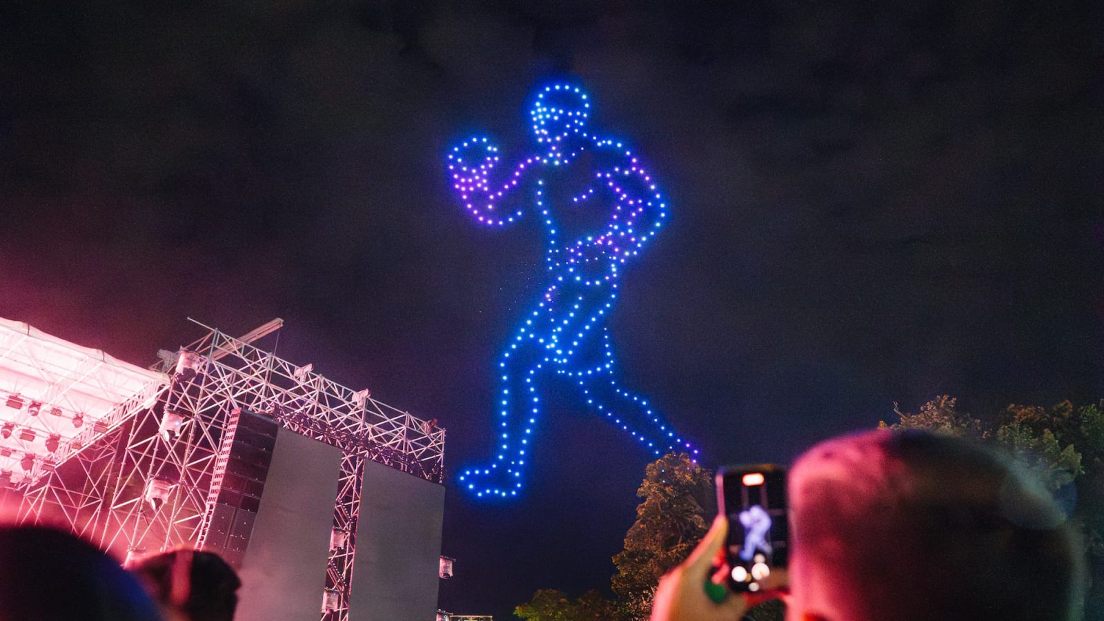GP4 drone-and-pyrotechnic show figure lighting up the night sky